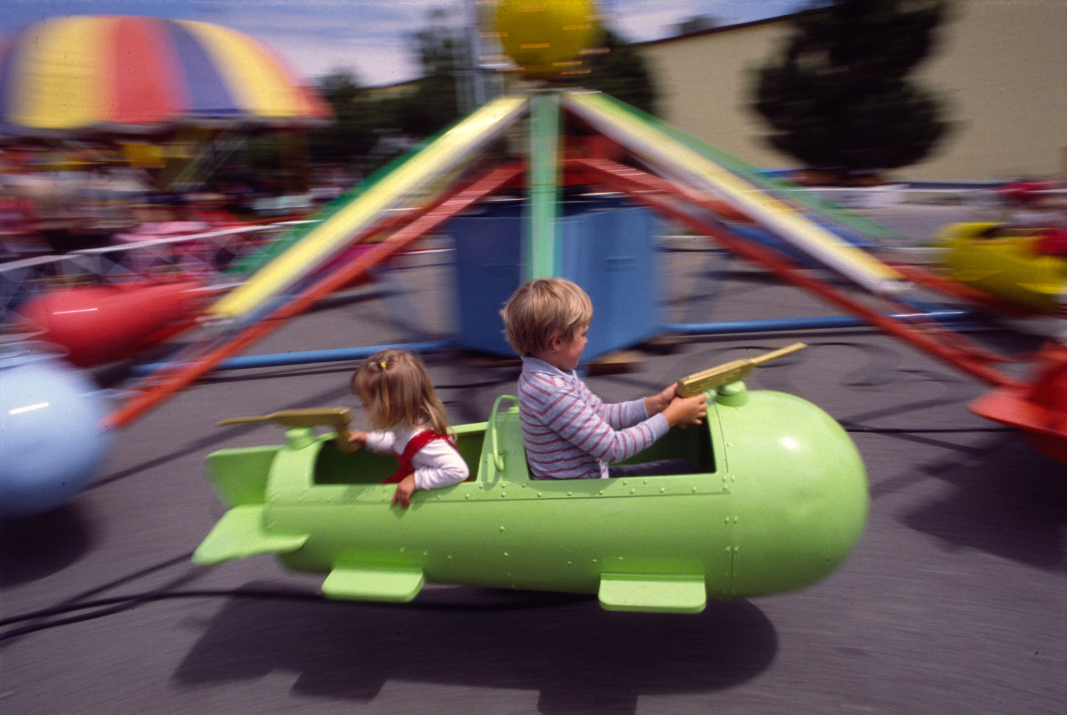 Children on carnival ride at Rimrock Mall, 1984